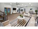 Bright open living space with a modern white color palette and decor at 8125 Park Side Dr, Raleigh, NC 27612