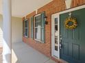 Charming entryway with green door and decorative wreath at 8417 Henderson Rd, Apex, NC 27539