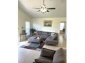Cozy living room features stylish sectional sofa and an abundance of natural light at 1721 Daniels Farm Rd, Mebane, NC 27302