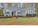 Home's exterior features lovely landscaping, roof, and well-maintained lawn at 198 Hillsdale Dr, Archer Lodge, NC 27527