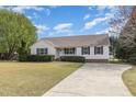 Well-maintained home with a long driveway and neat landscaping, offering great curb appeal at 201 Alice Dr, Garner, NC 27529