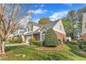 Nice townhome with a one car garage and a beautifully landscaped front lawn at 2043 White Pond Ct, Apex, NC 27523