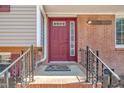 Inviting front door with decorative glass and brick accents, creating a warm and welcoming entrance at 215 Longview Dr, Smithfield, NC 27577