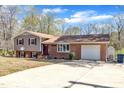 This home has a blend of brick and siding, attached garage and beautiful blue skies above the home at 215 Longview Dr, Smithfield, NC 27577