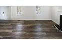Inviting living room space with hardwood floors, bright natural light, and modern fireplace at 23 Round Spring Ln, Durham, NC 27712