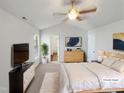 Bright main bedroom featuring a ceiling fan, a spacious layout, and soothing decor at 23 Round Spring Ln, Durham, NC 27712