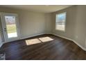 Cozy room with a door to the yard and a window allowing natural light to fill the space at 26 Harvest Hills Ln, Dunn, NC 28334