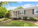 Lovely single story home with manicured lawn, sidewalk and attractive landscaping at 2706 Mcneil St St, Raleigh, NC 27608
