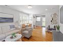 Bright living room with hardwood floors, stylish furniture and natural light from the windows at 2706 Mcneil St St, Raleigh, NC 27608