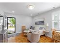 Inviting living room with hardwood floors, neutral paint, and comfortable seating arrangement at 2706 Mcneil St St, Raleigh, NC 27608