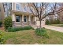 Attractive home exterior featuring a two-car garage and landscaped front yard with blooming plants at 3108 Bluff Oak Dr, Cary, NC 27519