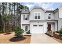 Charming two-story home with gray siding, manicured landscaping, and attached one-car garage at 4220 Congleton Pl, Durham, NC 27703