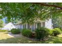Covered front porch with decorative iron railings, offering a peaceful outdoor space at 4516 Ocean Crest Cir, Raleigh, NC 27603