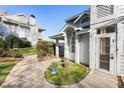 Exterior of building, showcasing landscaping and unique architectural details at 4911 Hollenden Dr # 208, Raleigh, NC 27616