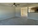 Bright, spacious living area with an open floor plan leading to the kitchen at 74 Harvest Hills Ln, Dunn, NC 28334