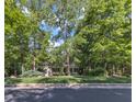 Charming single-story home with mature trees and a well-maintained lawn for great curb appeal at 85 Christenbury Ln, Clayton, NC 27527
