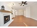 Spacious living room features a fireplace, hardwood floors, and an open floor plan at 1023 Kelton Cottage Way, Morrisville, NC 27560