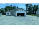 New construction home featuring an attached two car garage in a residential area at 1547 Pecan Drive # 31, Nashville, NC 27856
