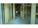 Spacious interior view of new construction home featuring wood framing and concrete flooring at 1547 Pecan Drive # 31, Nashville, NC 27856