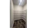 Pantry with dark tile floors and wire shelving, offering ample storage space at 1547 Pecan Drive # 31, Nashville, NC 27856