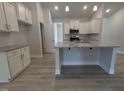 Bright kitchen featuring stainless appliances, granite countertops and island with seating at 1565 Pecan Drive # 30, Nashville, NC 27856