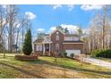 Charming brick two-story home with manicured lawn and attached two-car garage at 2053 Stillwood Dr, Youngsville, NC 27596