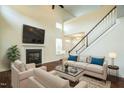 Bright living room with fireplace, vaulted ceiling, and hardwood floors at 310 Shale Creek Dr, Durham, NC 27703