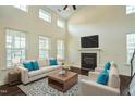Comfortable living room featuring a fireplace and an abundance of natural light at 310 Shale Creek Dr, Durham, NC 27703