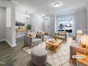 Bright living room with modern furnishings and a neutral color palette. (Virtually Staged) at 350 Gilman Ln # 104, Raleigh, NC 27610