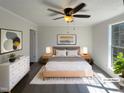 This is a lovely bedroom with a cozy bed and contemporary decorations at 5605 Christie Ln, Durham, NC 27713