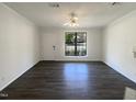 Bright and airy living room with modern flooring, perfect for entertaining and relaxation at 5605 Christie Ln, Durham, NC 27713
