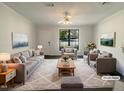 Bright living room features plush furniture and decor, creating a comfortable and inviting space at 5605 Christie Ln, Durham, NC 27713