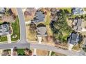Aerial view of residences in a mature subdivision with tree lined streets at 749 Hadrian Dr, Garner, NC 27529