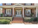 Close up showing detailed front entrance featuring a decorative door and brick steps at 749 Hadrian Dr, Garner, NC 27529