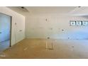 Spacious kitchen in progress with modern windows and ample electrical outlets at 95 Cherry Bark Dr, Youngsville, NC 27596