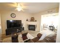 Inviting living room with fireplace and cozy brown leather couches at 2500 Friedland Pl # 101, Raleigh, NC 27617