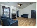 Spacious living room featuring hardwood style floors, a fireplace and modern ceiling fan at 3031 Winston Dr # Apt 302, Burlington, NC 27215