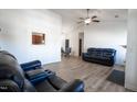 Bright living room boasting stylish, hardwood-style floors, a ceiling fan, and contemporary furniture at 3031 Winston Dr # Apt 302, Burlington, NC 27215