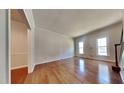 Inviting living room boasting hardwood floors, large windows, and classic trim at 3501 Kensett Way, Raleigh, NC 27616