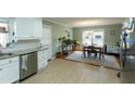 Eat-in kitchen area with stainless steel appliances and a view of the backyard at 410 N Currie Dr, Sanford, NC 27330