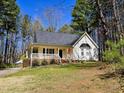 Traditional home boasting a lovely front porch and serene surroundings at 4116 Tall Pine Dr, Franklinton, NC 27525