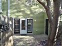 Back entrance view featuring double doors and access to the storage shed, perfect for convenience at 4425 Moss Garden Path, Raleigh, NC 27616