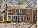 Charming two-story townhome with well-maintained landscaping and classic architectural details at 4447 Antique Ln, Raleigh, NC 27616