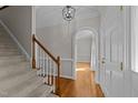 Bright foyer with hardwood floors, staircase and arched doorway at 5122 Berkeley St, Raleigh, NC 27612