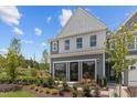 Charming two-story townhouse featuring a beautifully landscaped front yard, complemented by a bright, modern design at 628 Brittany Ct, Durham, NC 27703