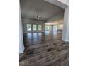 Spacious open-concept living room with ceiling fan and wood flooring at 644 Sweet Potato Lane # 36, Nashville, NC 27856