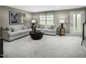Comfortable living room featuring neutral colors, plush seating, and stylish decor, perfect for relaxation at 713 Tambor Rd, Durham, NC 27713