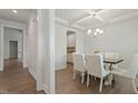 Elegant dining room with hardwood floors, decorative ceiling, and stylish chandelier, perfect for entertaining at 813 James J Freeland Dr, Hillsborough, NC 27278