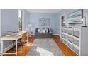 Cozy room offering a blend of relaxation and functionality, perfect as an office or additional living space at 100 Lochberry Ln, Cary, NC 27518