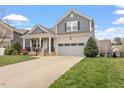 Attractive home with a two-car garage, concrete driveway and manicured lawn and shrubbery at 1020 Topland Ct, Morrisville, NC 27560